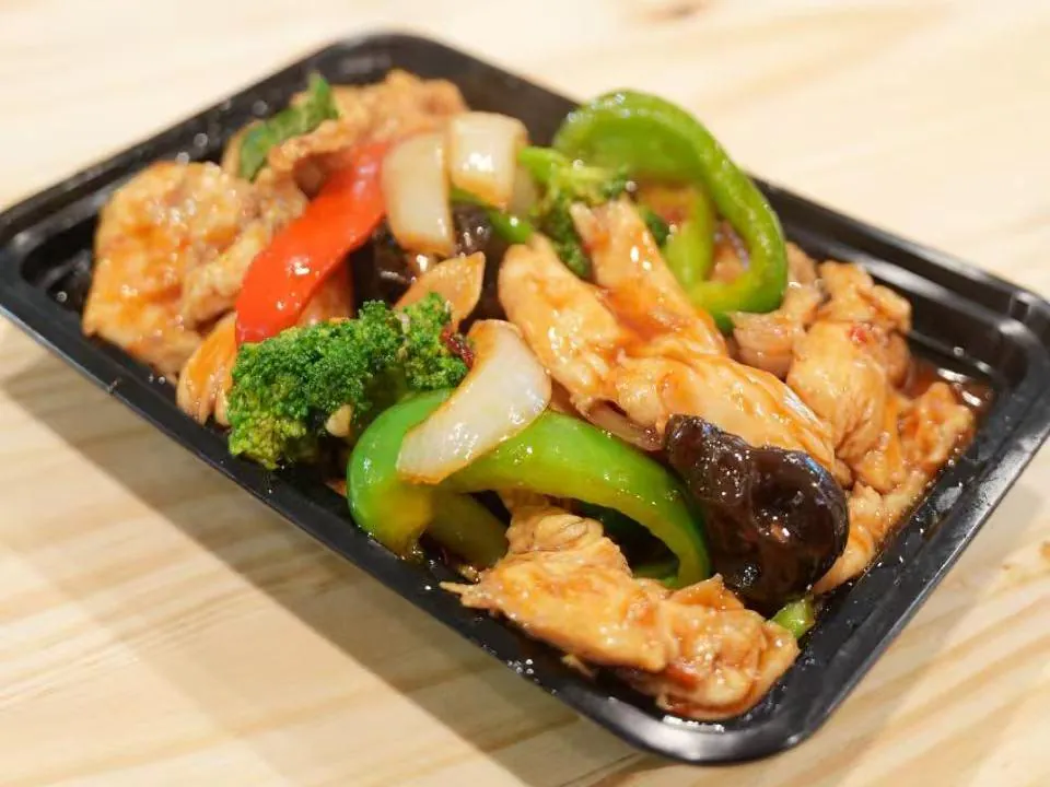 Stir-fried chicken with garlic and mixed peppers at Insomnia Kitchen, a Chinese Restaurant in Houston